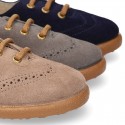 Suede leather kids Laces up style shoes with perforated design.