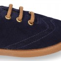 Suede leather kids Laces up style shoes with perforated design.