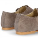 Laces up oxford shoes with DOUBLE BUCKLE fastening in suede leather for girls.