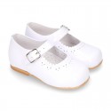Classic patent leather little Mary Janes with perforated flower design.