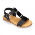 Combined leather sandals with patent and metal details finish.