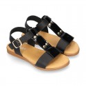 Combined leather sandals with patent and metal details finish.