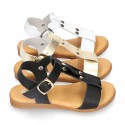 Combined leather sandals with patent and metal details finish.