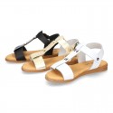 Combined leather sandals with patent and metal details finish.