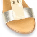 Combined leather sandals with patent and metal details finish.