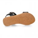 Combined leather sandals with patent and metal details finish.