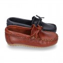 Tanned leather Moccasin shoes with bows.