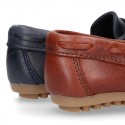 Tanned leather Moccasin shoes with bows.