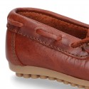 Tanned leather Moccasin shoes with bows.