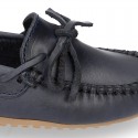 Tanned leather Moccasin shoes with bows.