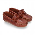 Tanned leather Moccasin shoes with bows.