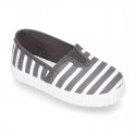 Cotton cavas Sneaker or bamba style shoes with stripes design.