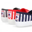 Cotton cavas Sneaker or bamba style shoes with stripes design.