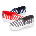 Cotton cavas Sneaker or bamba style shoes with stripes design.