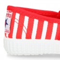 Cotton cavas Sneaker or bamba style shoes with stripes design.