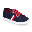 New cotton canvas tennis shoes with flag detail.