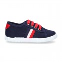 New cotton canvas tennis shoes with flag detail.