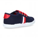New cotton canvas tennis shoes with flag detail.