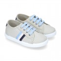 New cotton canvas tennis shoes with flag detail.