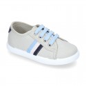 New cotton canvas tennis shoes with flag detail.