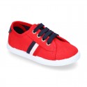 New cotton canvas tennis shoes with flag detail.