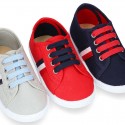 New cotton canvas tennis shoes with flag detail.