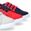 New cotton canvas tennis shoes with flag detail.