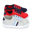 New cotton canvas tennis shoes with flag detail.