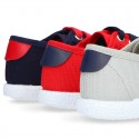 New cotton canvas tennis shoes with flag detail.