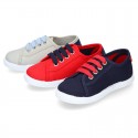 New cotton canvas tennis shoes with flag detail.