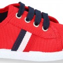 New cotton canvas tennis shoes with flag detail.