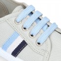 New cotton canvas tennis shoes with flag detail.