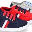 New cotton canvas tennis shoes with flag detail.