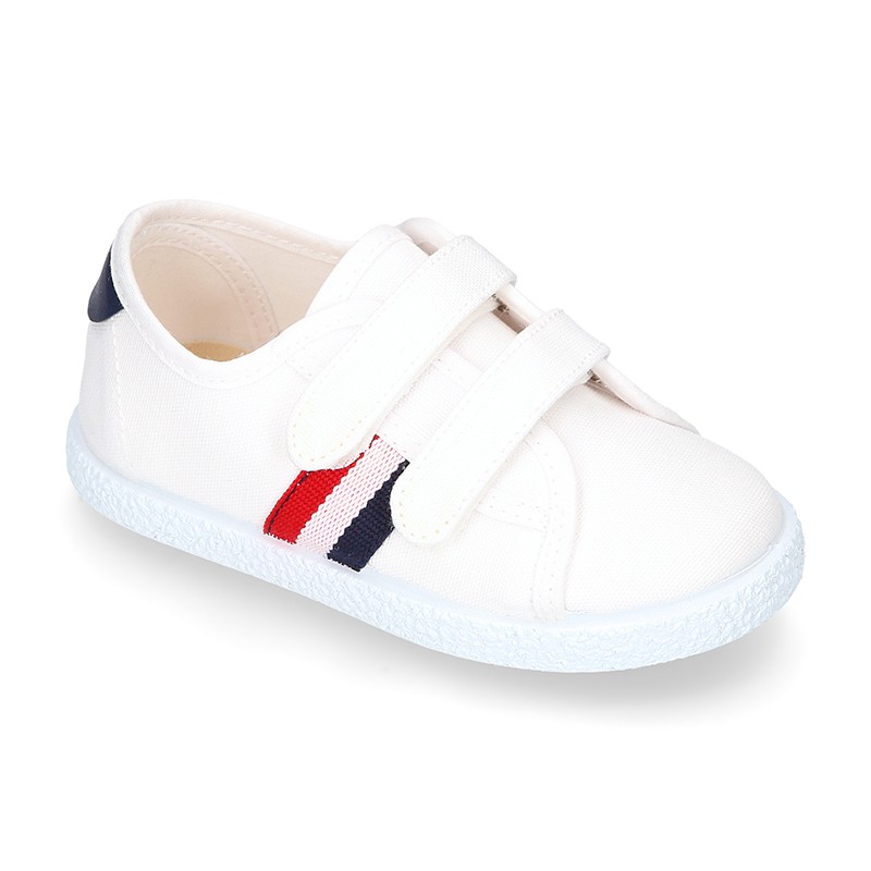 Tenis niño sin cordones en lona con bandera. TK049