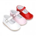 Baby Nappa leather Mary Jane shoes with buckle fastening and flexible soles .