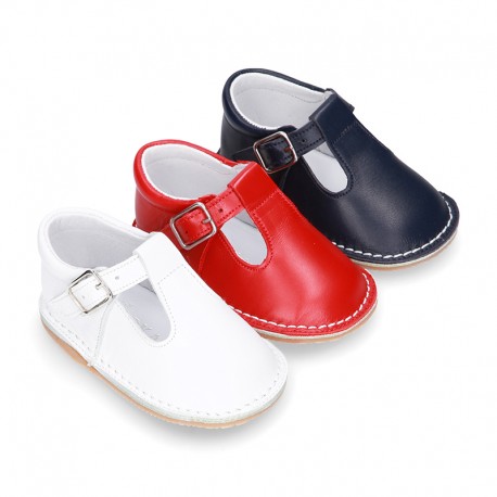 Baby Nappa leather T-bar shoes with buckle fastening and flexible soles .