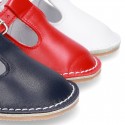 Baby Nappa leather T-bar shoes with buckle fastening and flexible soles .