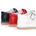 Baby Nappa leather T-bar shoes with buckle fastening and flexible soles .