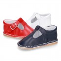 Baby Nappa leather T-bar shoes with buckle fastening and flexible soles .