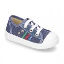 Cotton canvas sneakers with zipper and ties closure and toe cap.