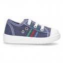 Cotton canvas sneakers with zipper and ties closure and toe cap.