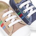 Cotton canvas sneakers with zipper and ties closure and toe cap.