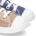 Cotton canvas sneakers with zipper and ties closure and toe cap.