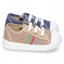 Cotton canvas sneakers with zipper and ties closure and toe cap.