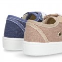 Cotton canvas sneakers with zipper and ties closure and toe cap.