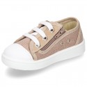 Cotton canvas sneakers with zipper and ties closure and toe cap.