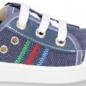 Cotton canvas sneakers with zipper and ties closure and toe cap.