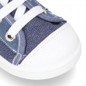 Cotton canvas sneakers with zipper and ties closure and toe cap.