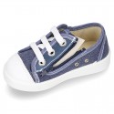 Cotton canvas sneakers with zipper and ties closure and toe cap.