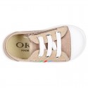 Cotton canvas sneakers with zipper and ties closure and toe cap.